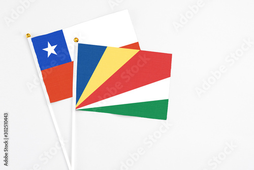 Seychelles and Chile stick flags on white background. High quality fabric, miniature national flag. Peaceful global concept.White floor for copy space. Free Download Seychelles and Chile stick flags on white background. High quality fabric, miniature national flag. Peaceful global concept.White floor for copy space. - GFXLoad
