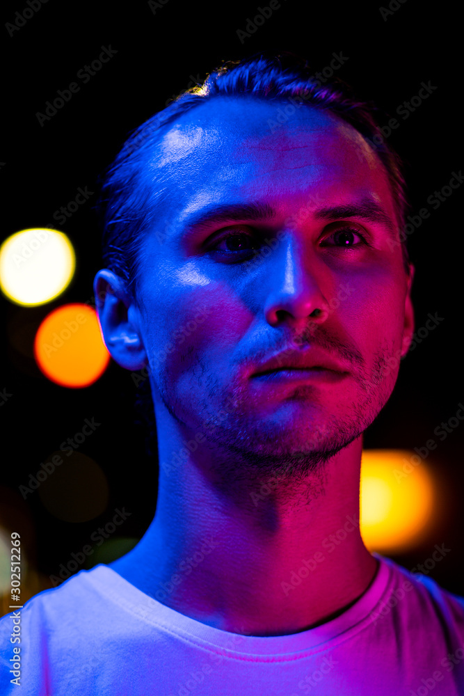 Modern red and blue light portrait of a young man Modern red and blue light portrait of a young man