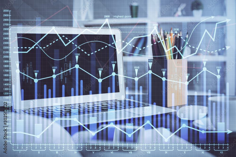 Financial market graph hologram and personal computer on background. Double exposure. Concept of forex. Financial market graph hologram and personal computer on background. Double exposure. Concept of forex.