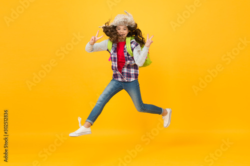 She is free. Autumn vacation has just begun. Happy girl celebrate vacation time. Small child enjoy school vacation. Day out or weekend. Vacation or school break. Holidays. Freedom