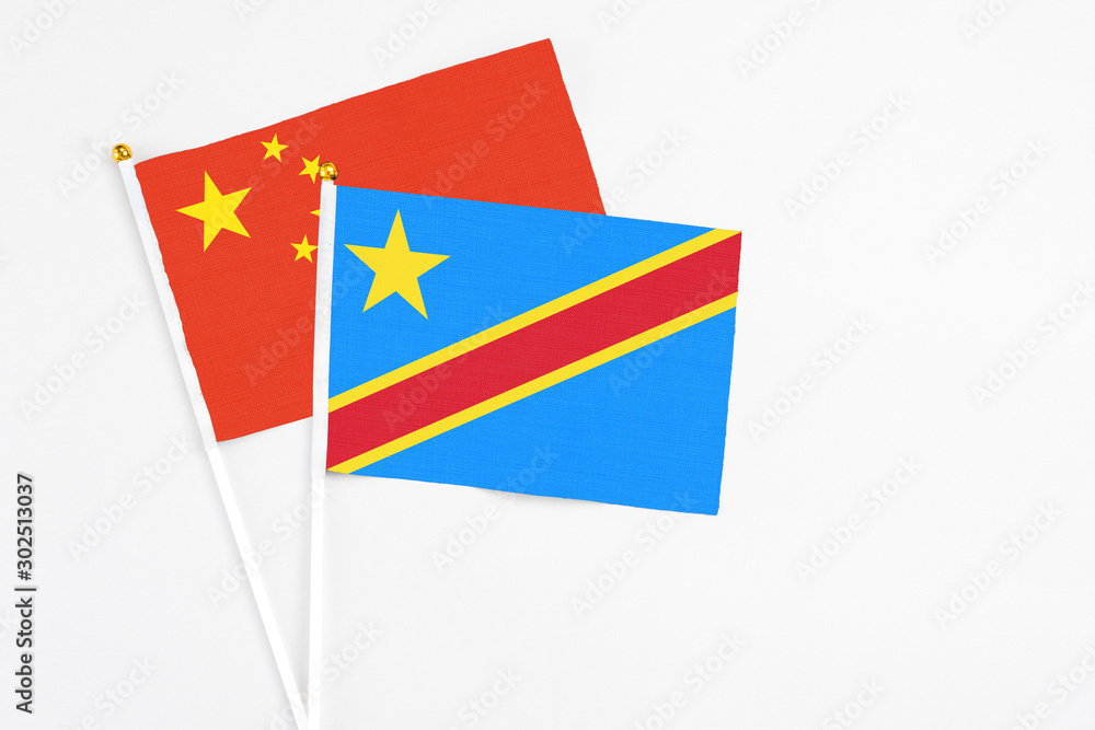Congo and China stick flags on white background. High quality fabric, miniature national flag. Peaceful global concept.White floor for copy space. Congo and China stick flags on white background. High quality fabric, miniature national flag. Peaceful global concept.White floor for copy space.