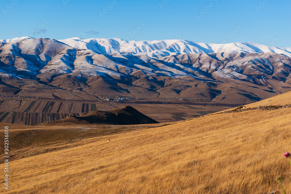 Breathtaking snowy mountain landscape with settlements, Armenia