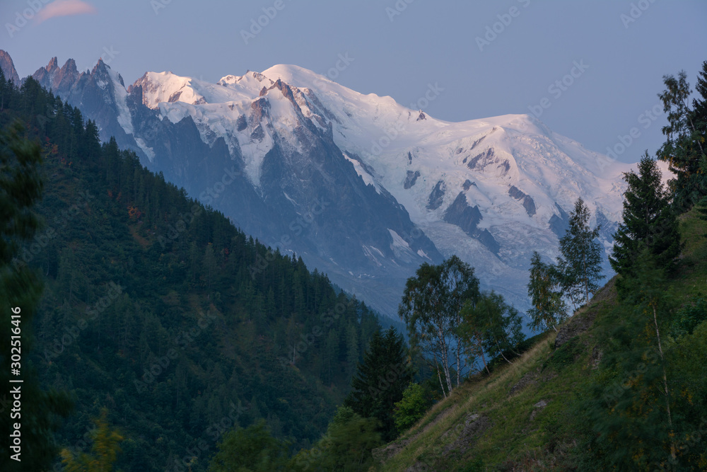 Evening and morning view of the town of Chamonix and Mount Mont Blanc.	
