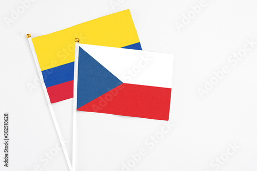 Free Download Czech Republic and Colombia stick flags on white background. High quality fabric, miniature national flag. Peaceful global concept.White floor for copy space. - GFXLoad