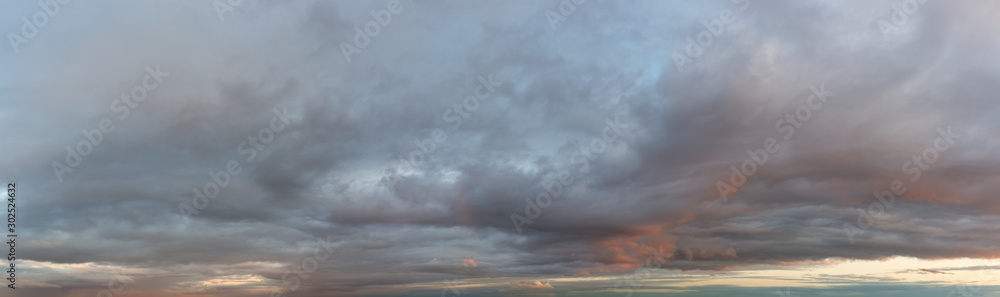 Fantastic dark thunderclouds, natural sky composition - wide panorama