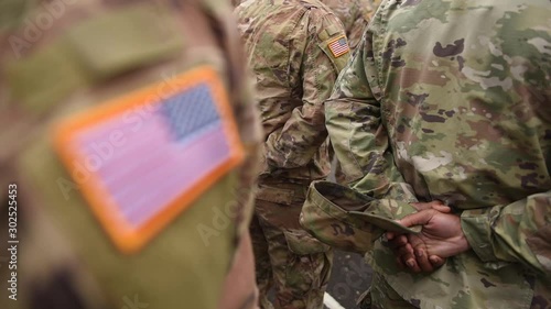 US soldiers. US army. USA patch flag on the US military uniform. Soldiers on the parade ground from the back. Veterans Day. Memorial Day.