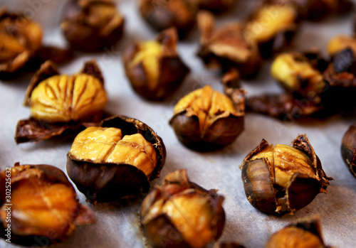 open chestnuts on a tray after baking