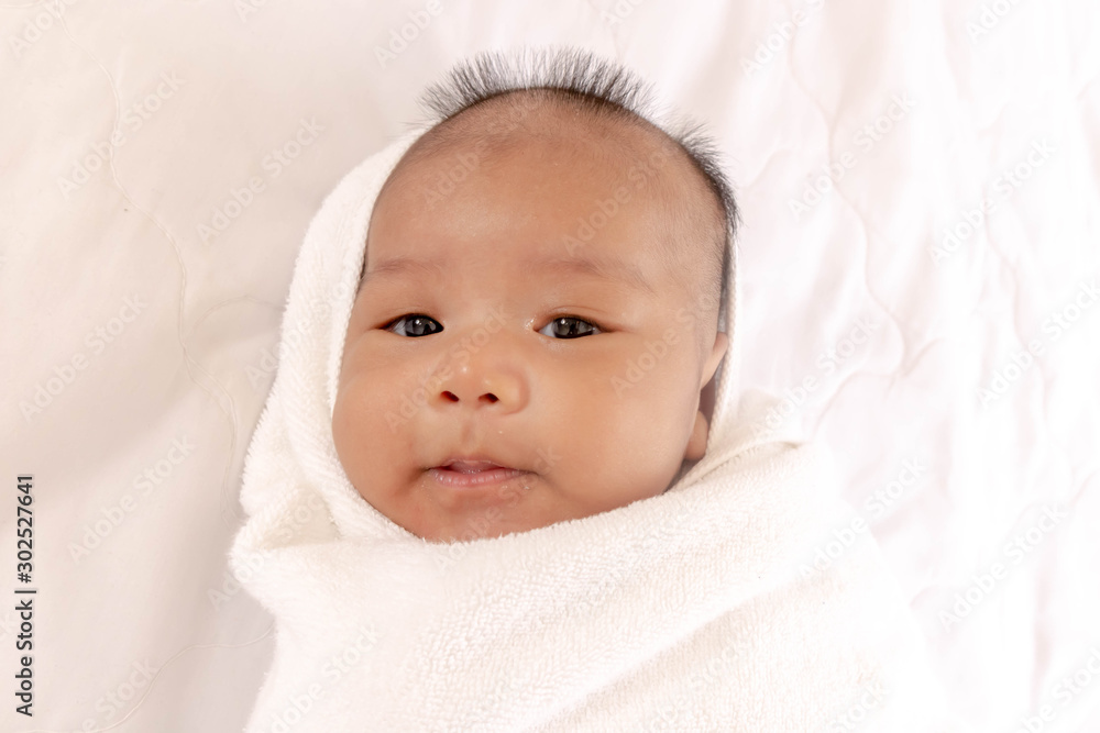 Newborn babies sleep on their back Being wrapped up in a white bed in a good mood During bedtime, the child's brain will work. To enhance Memory-boosting and learning-building skills Newborn babies sleep on their back Being wrapped up in a white bed in a good mood During bedtime, the child's brain will work. To enhance Memory-boosting and learning-building skills