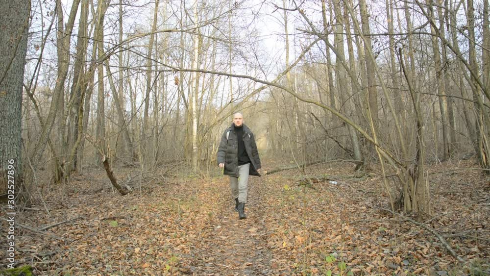 Caucasian young man outdoors in nature, man hiking in forest hd stock footage Caucasian young man outdoors in nature, man hiking in forest hd stock footage