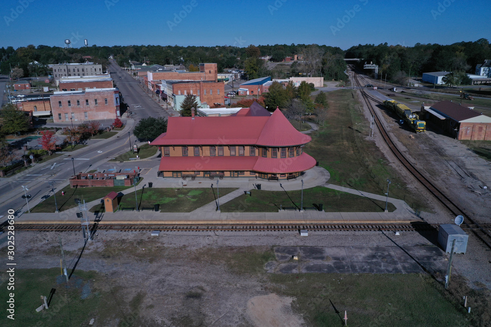 Fototapeta premium Aerial view of the Old Hamlet NC Train depot. Serving as the terminal for Amtrak. Old historic building.