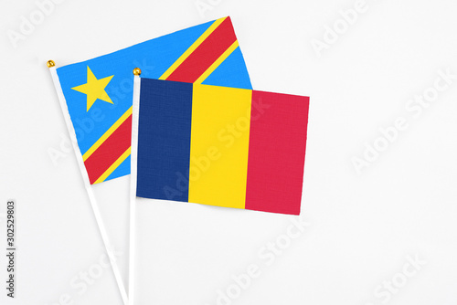 Chad and Congo stick flags on white background. High quality fabric, miniature national flag. Peaceful global concept.White floor for copy space.