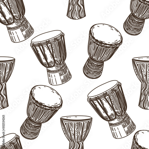 Vector hand drawn seamless pattern of African drums in the style of engraving on white background.