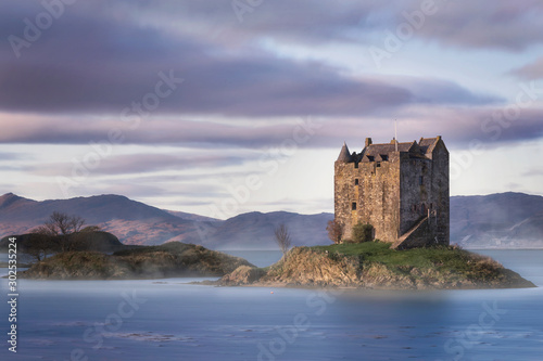 Canvas Print Fairytale Castle surrounded by water in the Scottish Highlands