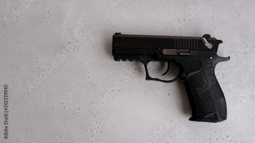 9mm Jorge Handgun isolated on a gray background. Concept crime