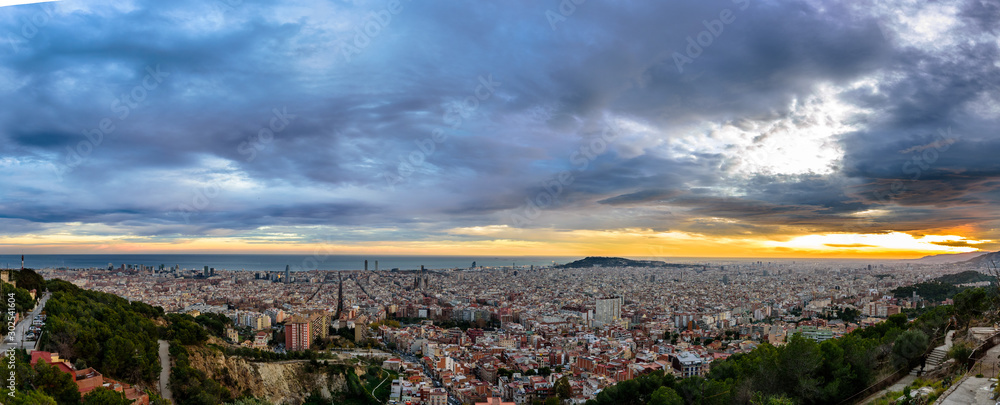 panorama of Barcelona by golden light during the sunset