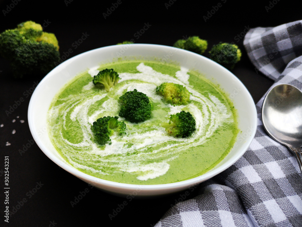 Bowl of broccoli soup with coconut cream Bowl of broccoli soup with coconut cream