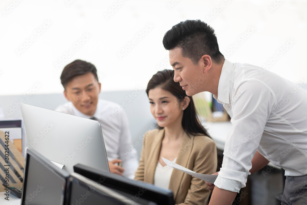 Chinese business people working in office Chinese business people working in office