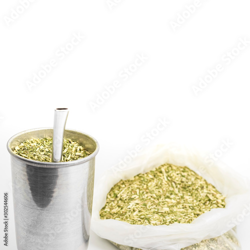 Terere drink. Cold beverage typical from the midwest of brazil. Infusion of mate herb, Sul Mato Grossense beverage on a aluminum cup and the pump.