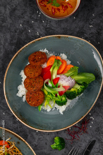 Falafels with rice and vegetables. Healthy vegetarian lifestyle.