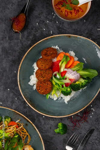 Falafels with rice and vegetables. Healthy vegetarian lifestyle.