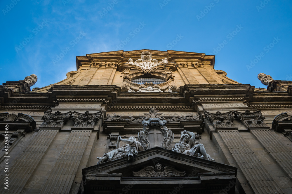 Statue on the wall of the church of Saints Michael and Cajetan, Florence, Italy