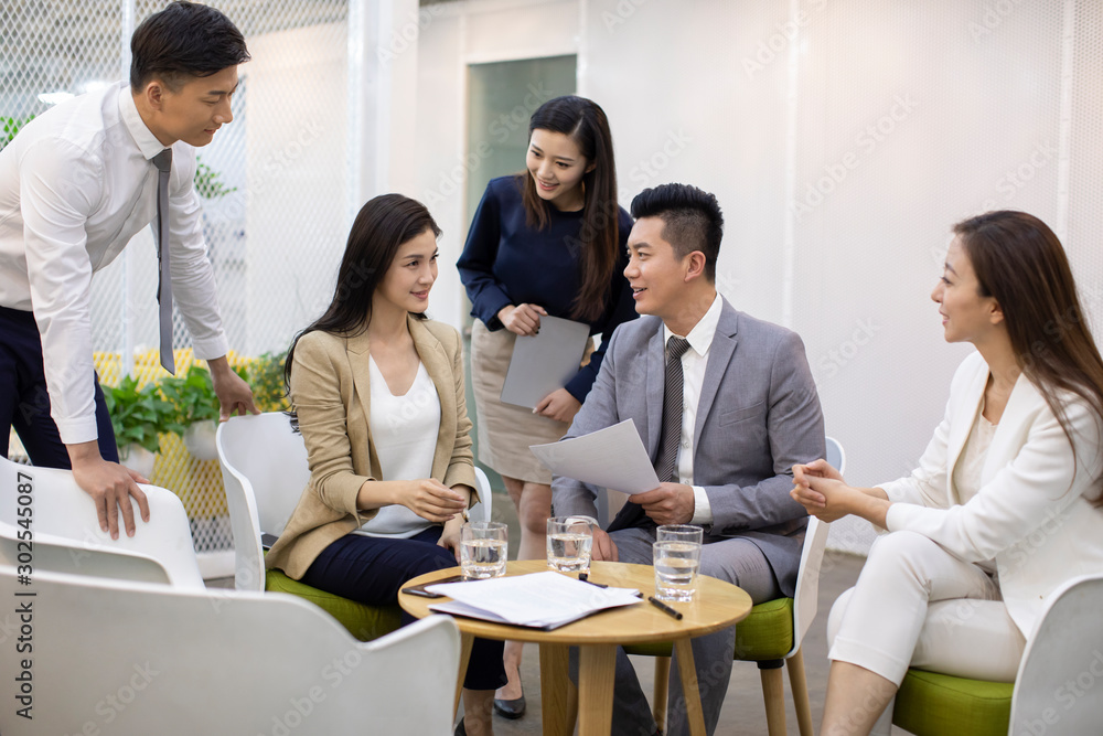 Chinese business people having a meeting in office Chinese business people having a meeting in office