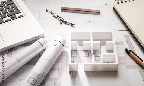 Fototapeta samoprzylepna Koncepcja budowy. Rysunki budynków mieszkalnych i model domu,