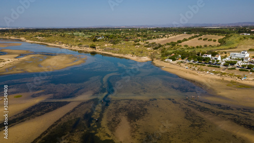 Aerial. View from the sky of the beach of Fabrica Cancela Velha, Vila Real Santo Antonio. Portugal Algarve