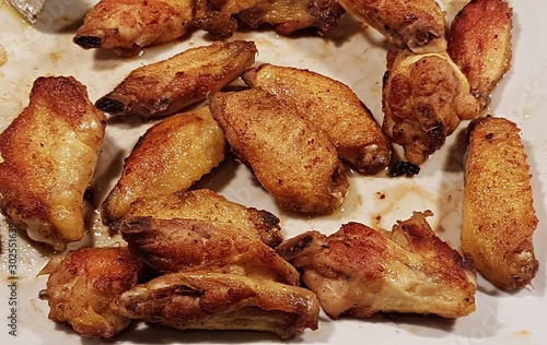 Grilled chicken small marinated wings and look very juicy and mouth-watering