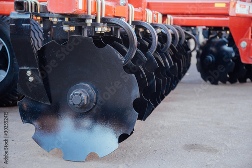 Fototapeta Working parts of new modern agricultural disc harrow for tillage