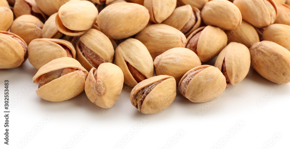 Tasty pistachio nuts isolated on white Tasty pistachio nuts isolated on white