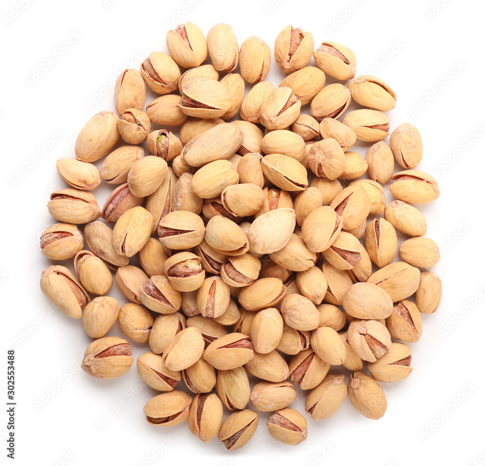 Tasty pistachio nuts isolated on white Tasty pistachio nuts isolated on white