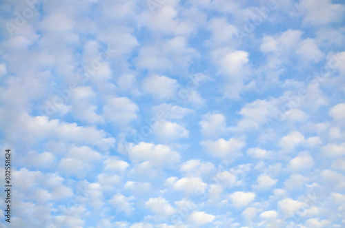 cloudscape with altocumulus clouds at sunny day photo