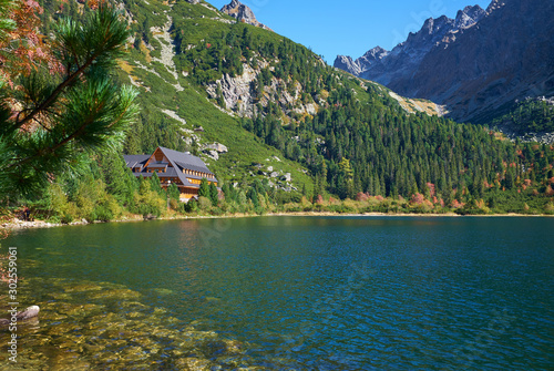 Fototapeta Naklejka Na Ścianę i Meble -  The beautiful aPoprad lake surrounded by mountains and colorful forests in High Tatras National Park, Slovakia