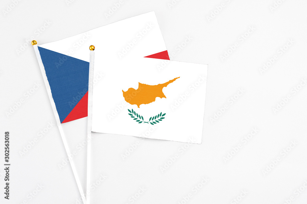 Cyprus and Cyprus stick flags on white background. High quality fabric, miniature national flag. Peaceful global concept.White floor for copy space. Cyprus and Cyprus stick flags on white background. High quality fabric, miniature national flag. Peaceful global concept.White floor for copy space.