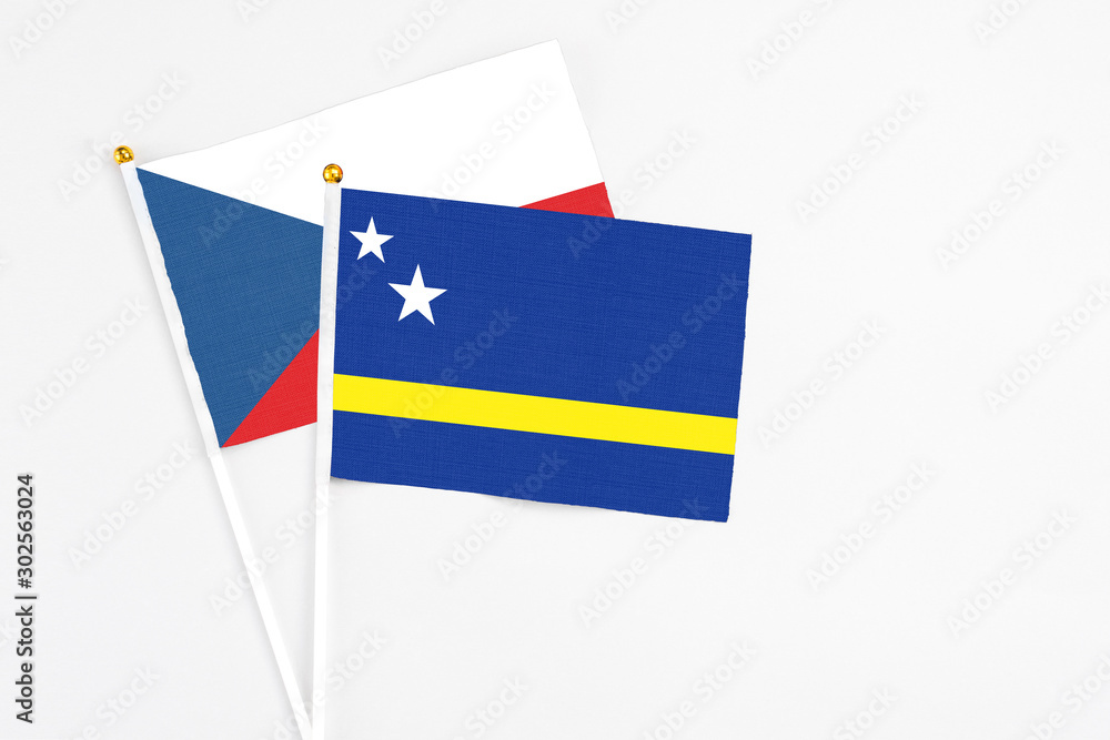 Curacao and Cyprus stick flags on white background. High quality fabric, miniature national flag. Peaceful global concept.White floor for copy space. Curacao and Cyprus stick flags on white background. High quality fabric, miniature national flag. Peaceful global concept.White floor for copy space.