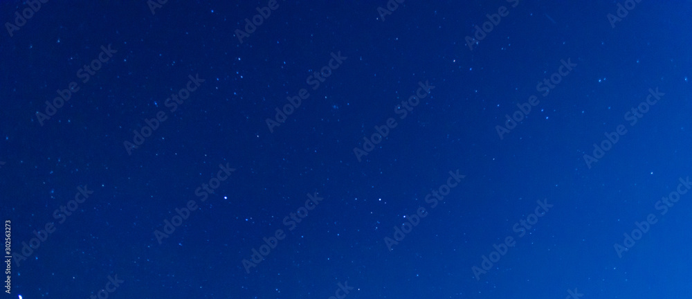 Panorama blue night sky milky way and star on dark background.Universe filled with nebula and galaxy. with noise and grain.Photo by long exposure and select white balance.selection focus.amazing