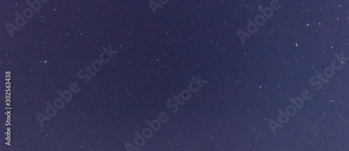 Panorama blue night sky milky way and star on dark background.Universe filled with stars, nebula and galaxy with noise and grain.Photo by long exposure and select white balance.selection focus.amazing