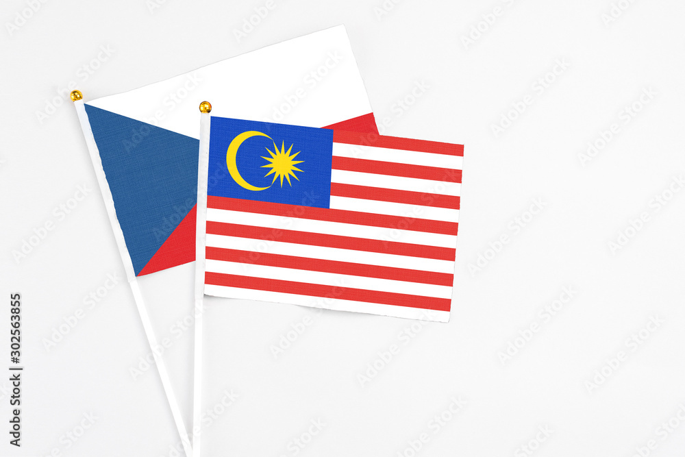 Malaysia and Cyprus stick flags on white background. High quality fabric, miniature national flag. Peaceful global concept.White floor for copy space. Malaysia and Cyprus stick flags on white background. High quality fabric, miniature national flag. Peaceful global concept.White floor for copy space.