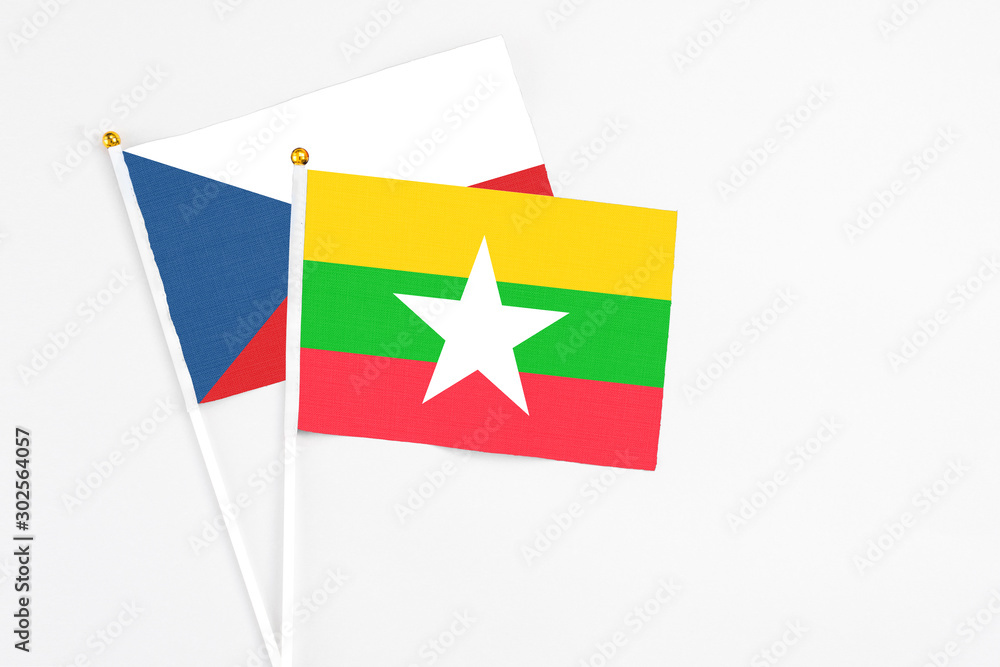Myanmar and Cyprus stick flags on white background. High quality fabric, miniature national flag. Peaceful global concept.White floor for copy space. Myanmar and Cyprus stick flags on white background. High quality fabric, miniature national flag. Peaceful global concept.White floor for copy space.
