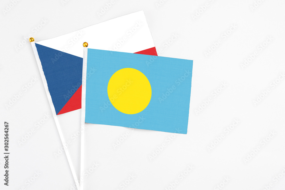 Palau and Cyprus stick flags on white background. High quality fabric, miniature national flag. Peaceful global concept.White floor for copy space. Palau and Cyprus stick flags on white background. High quality fabric, miniature national flag. Peaceful global concept.White floor for copy space.