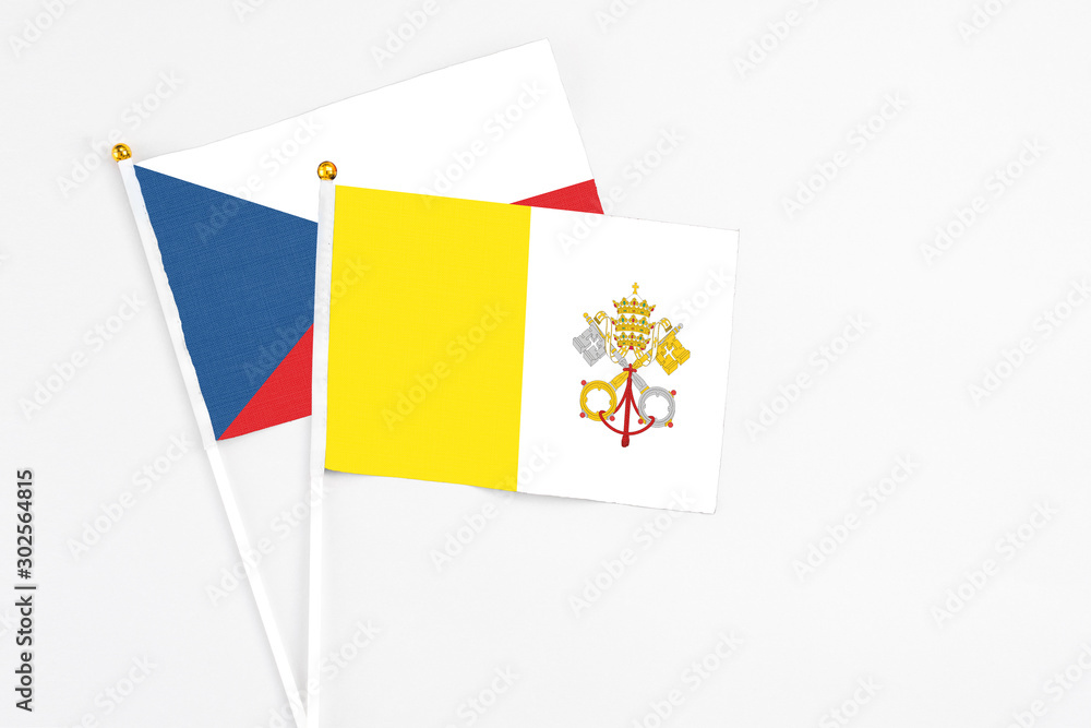 Vatican City and Cyprus stick flags on white background. High quality fabric, miniature national flag. Peaceful global concept.White floor for copy space. Vatican City and Cyprus stick flags on white background. High quality fabric, miniature national flag. Peaceful global concept.White floor for copy space.