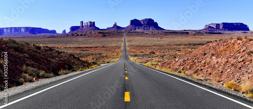Road into the red rock desert landscape of Monument Valley, Navajo Tribal Park in the southwest USA in Arizona and Utah photo