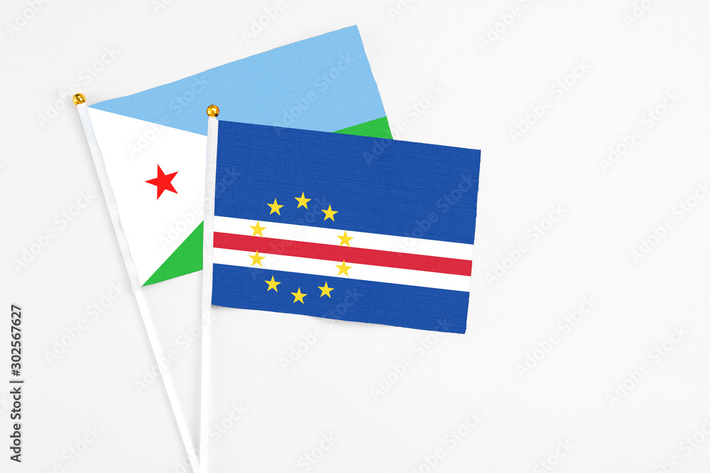 Cape Verde and Djibouti stick flags on white background. High quality fabric, miniature national flag. Peaceful global concept.White floor for copy space. Cape Verde and Djibouti stick flags on white background. High quality fabric, miniature national flag. Peaceful global concept.White floor for copy space.