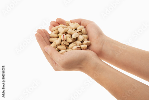 pistachio in hand with white background