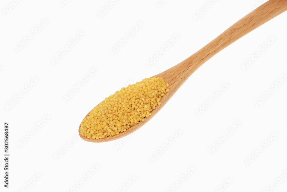 millet in spoon with white background millet in spoon with white background