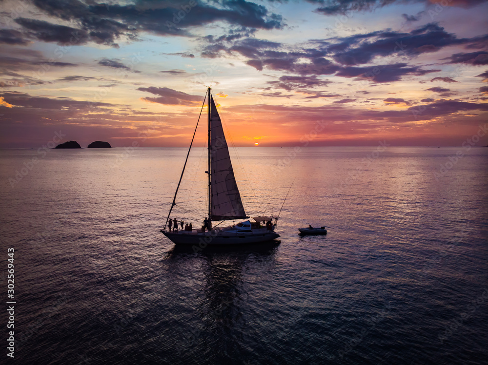Sail boat agains the sunset