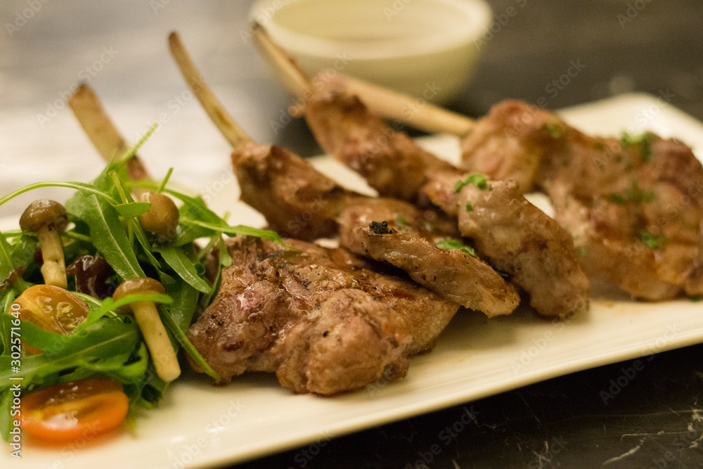 grilled rack of lamb lamb chops with mushroom and salad on the side