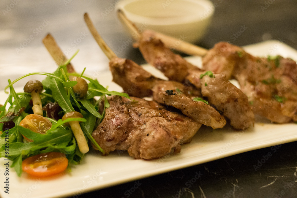 grilled rack of lamb lamb chops with mushroom and salad on the side grilled rack of lamb lamb chops with mushroom and salad on the side