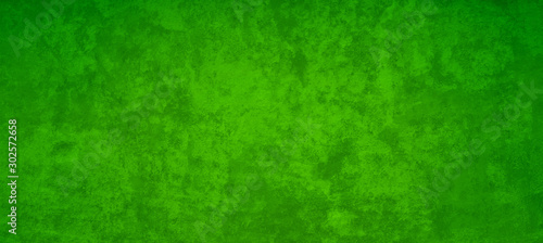 Old green Christmas background with distressed vintage texture and dark border grunge